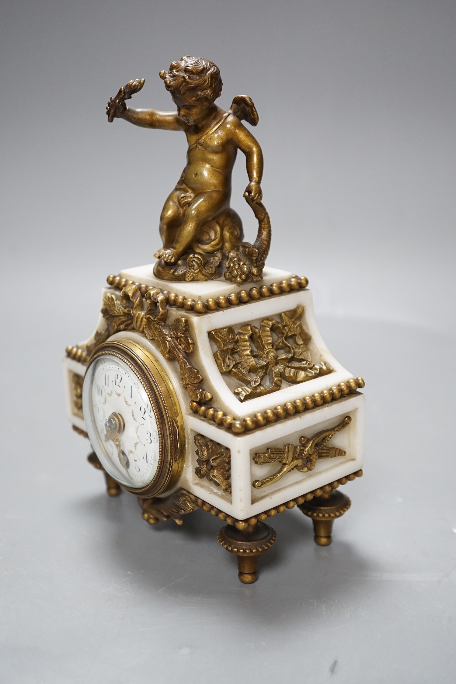 An early 20th century French marble and ormolu cherubic timepiece, height 19cm